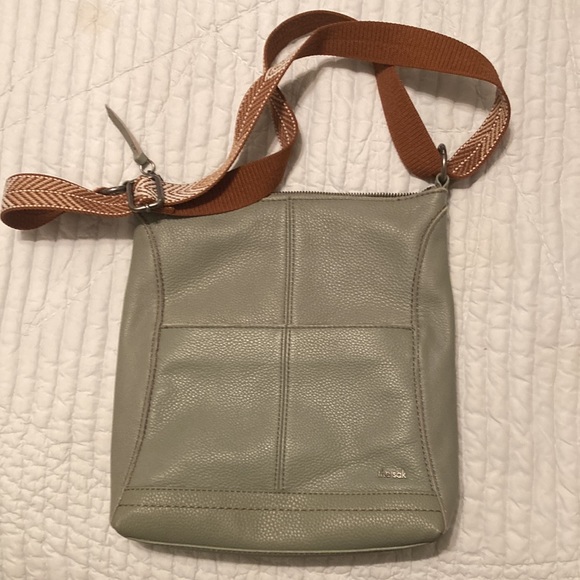 Like new the sak handbag. Sage green with adjustable arrow print strap. - Picture 3 of 3